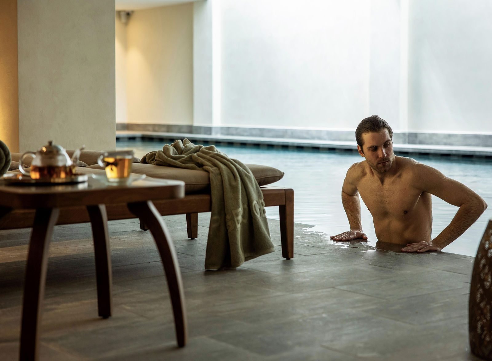 Male model relaxing at the spa pool at Cap St Georges Hotel and Resort